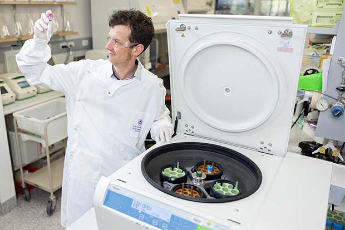 Professor Keith Chappell in the lab using a centrifuge