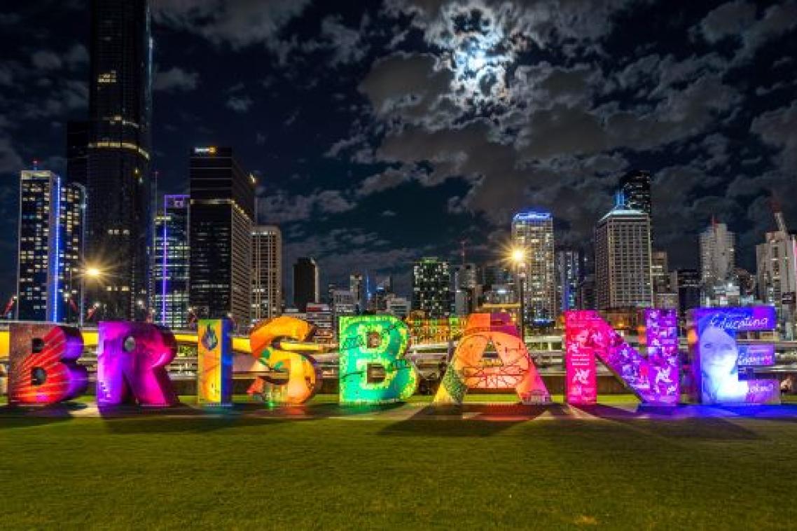 Large block letters placed on a grass patch, reading the name "Brisbane."