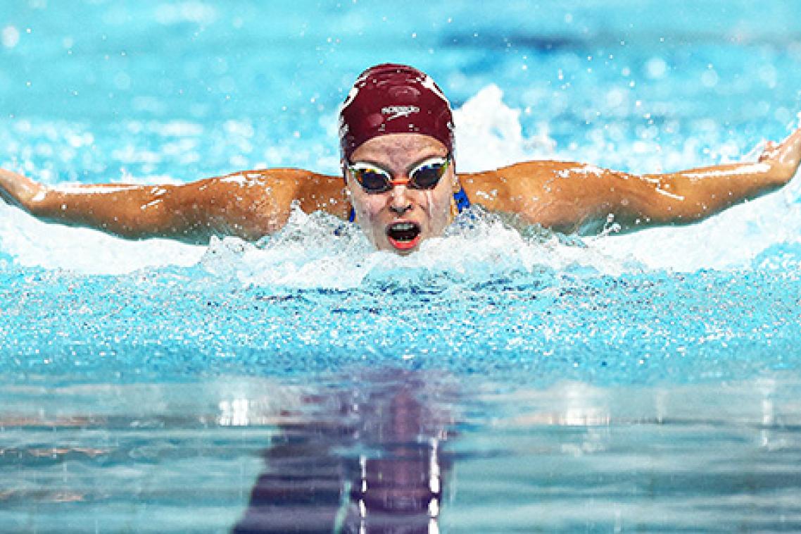 An elite swimmer racing in a pool