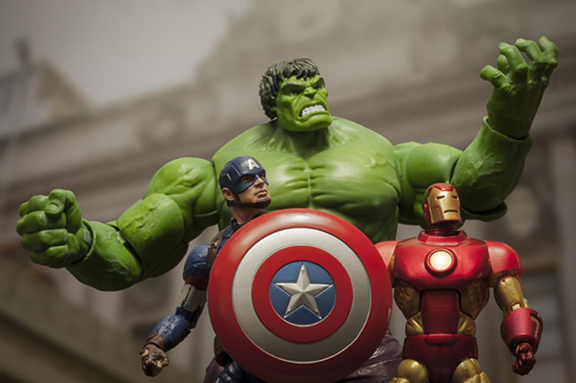 Three action figure superheroes