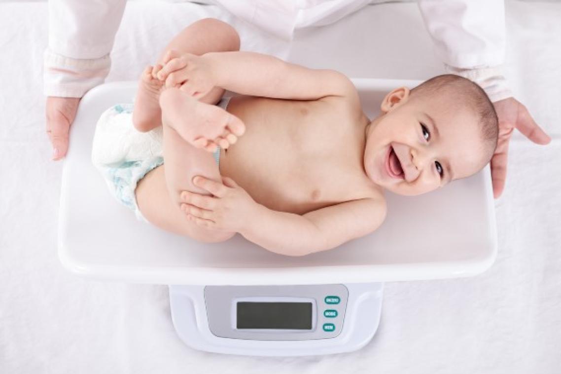 Baby on baby scale.