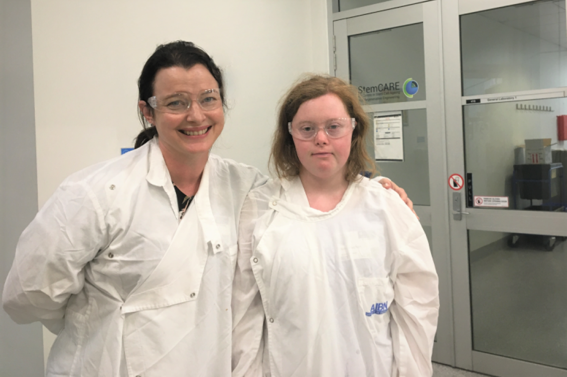 Two women in white lab coats
