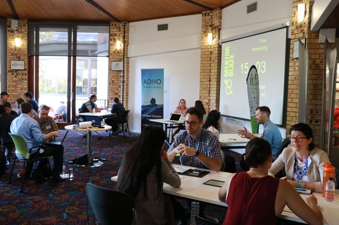 Entrepreneurs and mentors discussing ideas at MentorBlaze