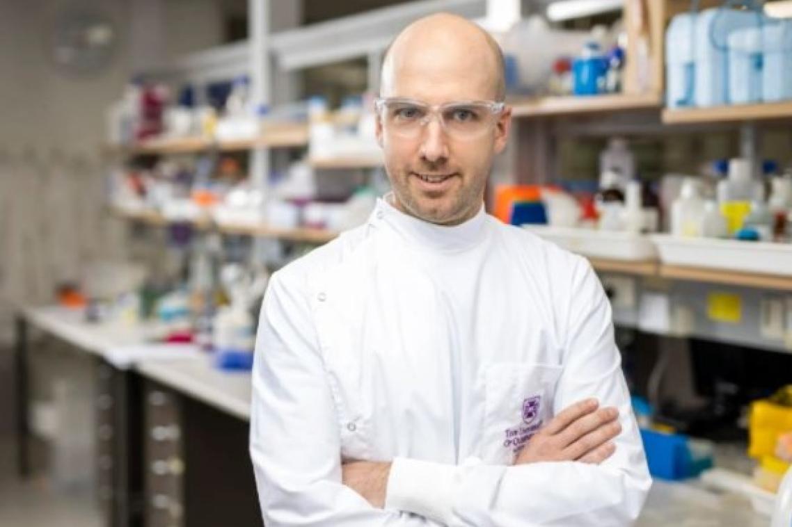 Dr Daniel Watterson in research lab.