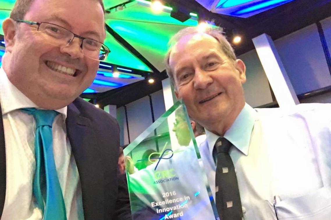 Professor Peter Halley and QUT’s Emeritus Professor Graeme George with the award.