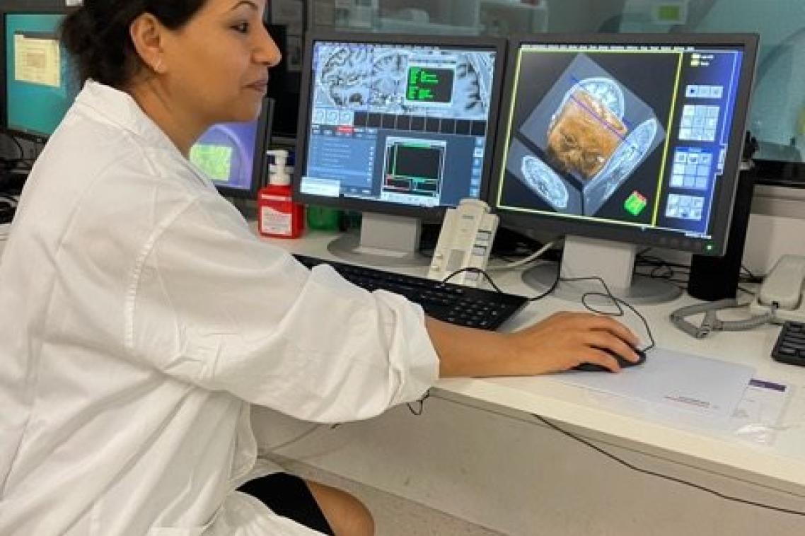 Dr Fatima Nasrallah looking at images of the brain