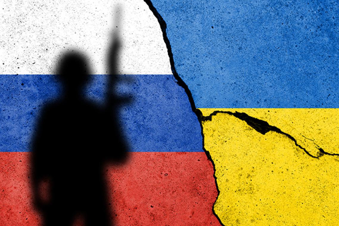 The flags of Russia and Ukraine with the silhouette of a soldier in front