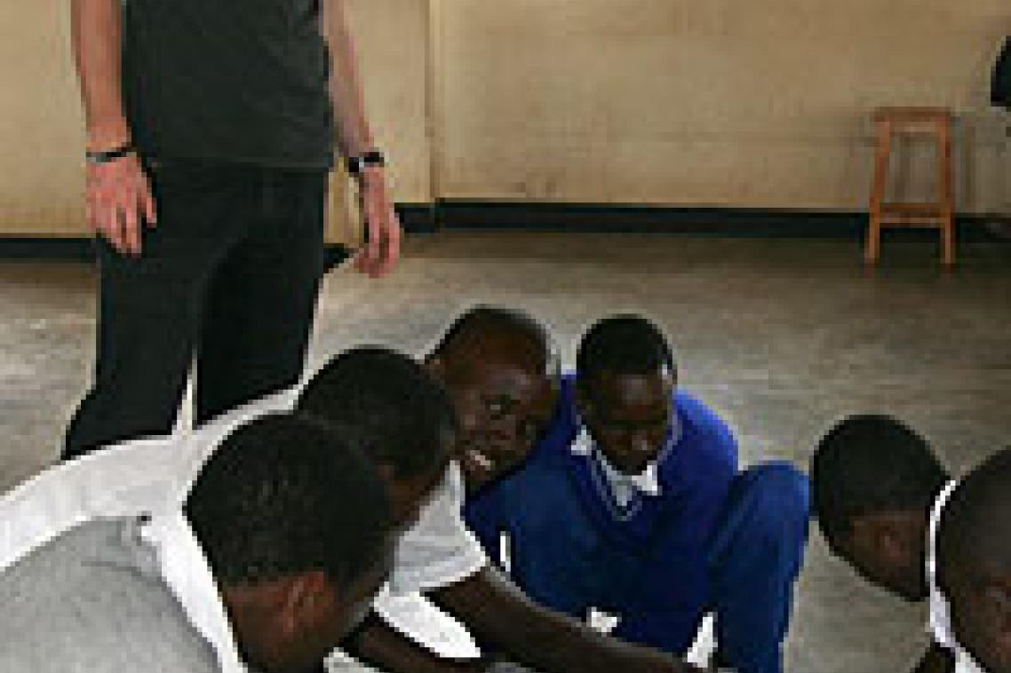 UQ medical student Sean Mitchell working with high school students in Rwanda