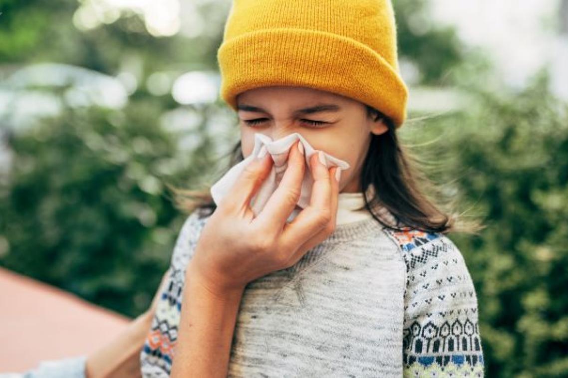 A child blowing nose