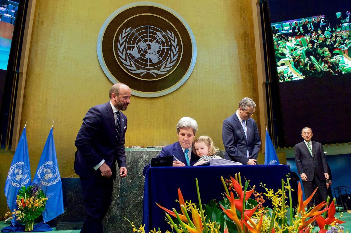 US Secretary of State John Kerry signs the COP21 UN Climate Change agreement.