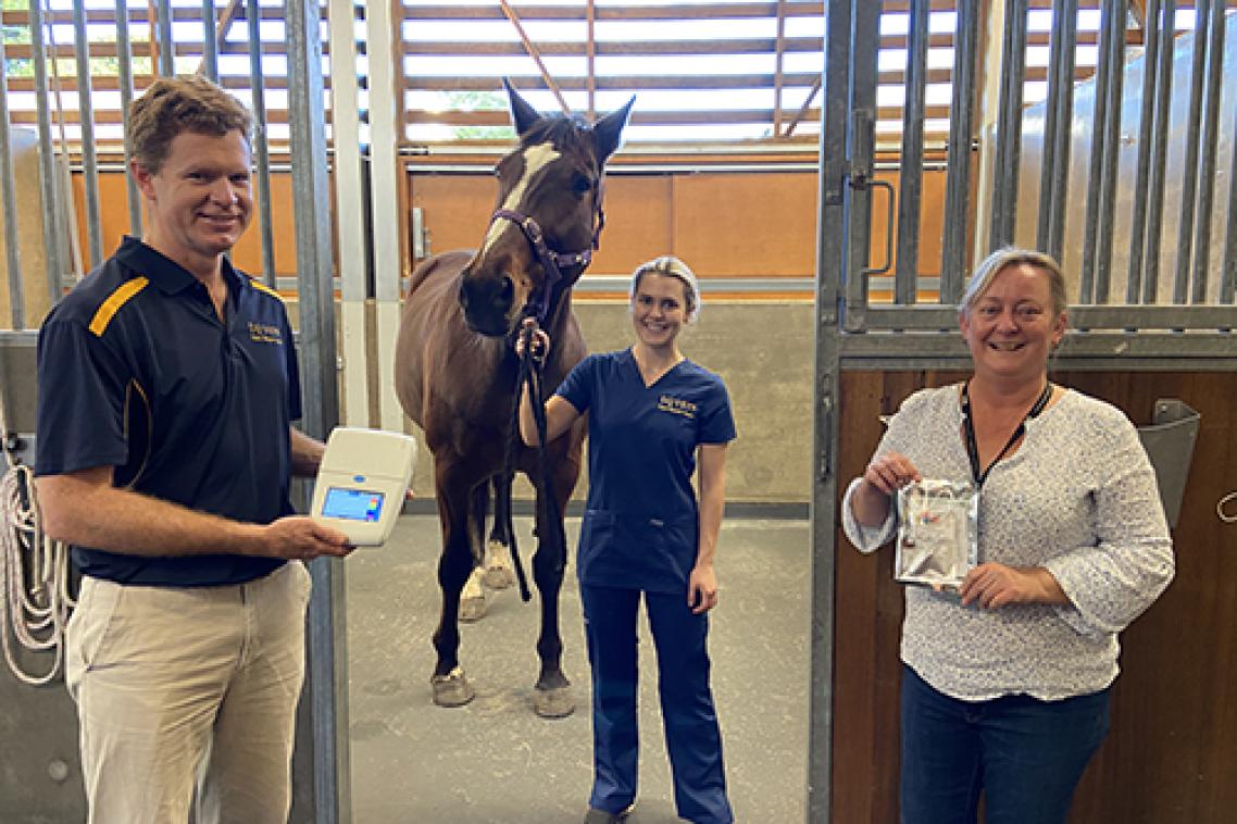 (L-R) UQ's Prof. Ben Ahern with a LAMP Genie III diagnostic machine, veterinary nurse Gabriella Doxey with horse Cartouche and veterinary researcher Lyndal Hulse holding the Hendra diagnostic sampling kit.