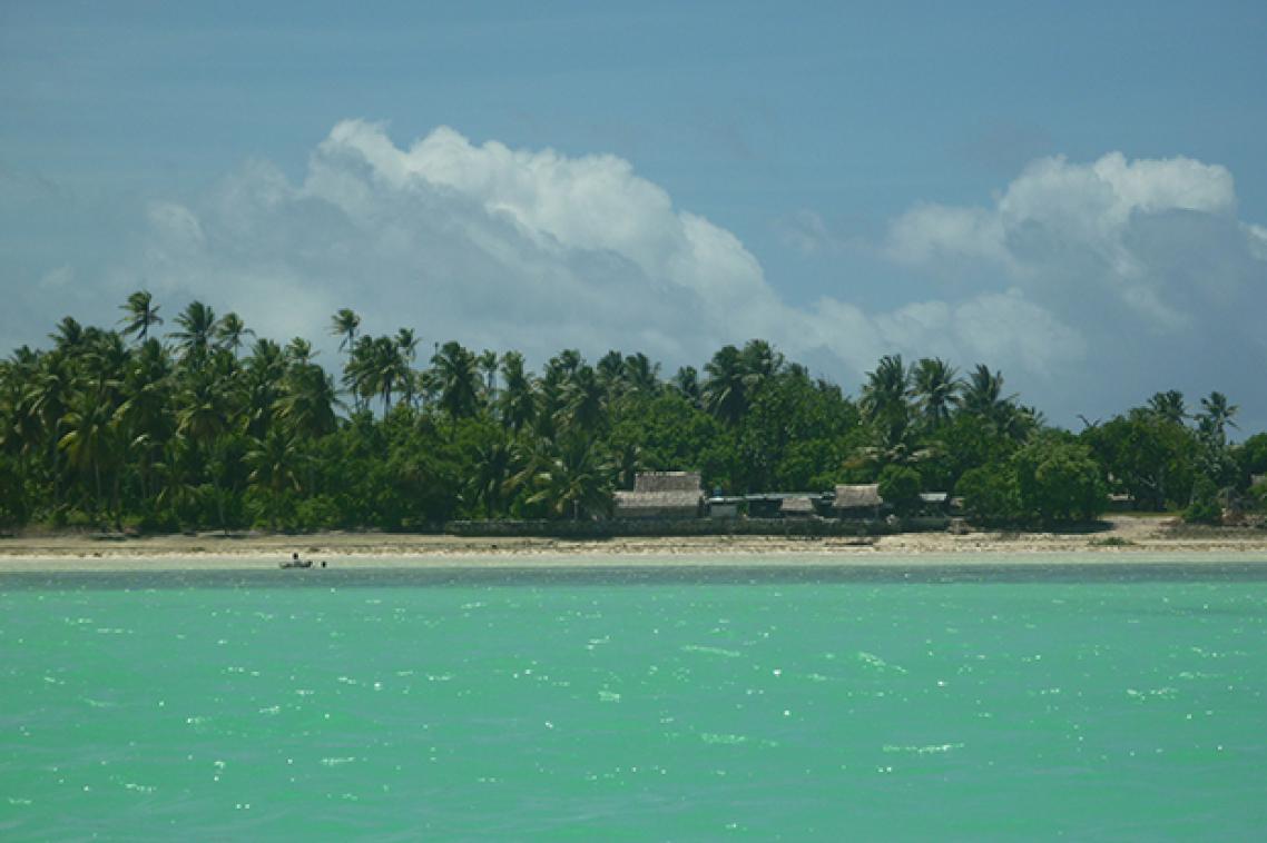 Looking from the lagoon across at homes on Abaiang Island, a low-lying coral atoll in Kiribati. (Credit: Karen McNamara)