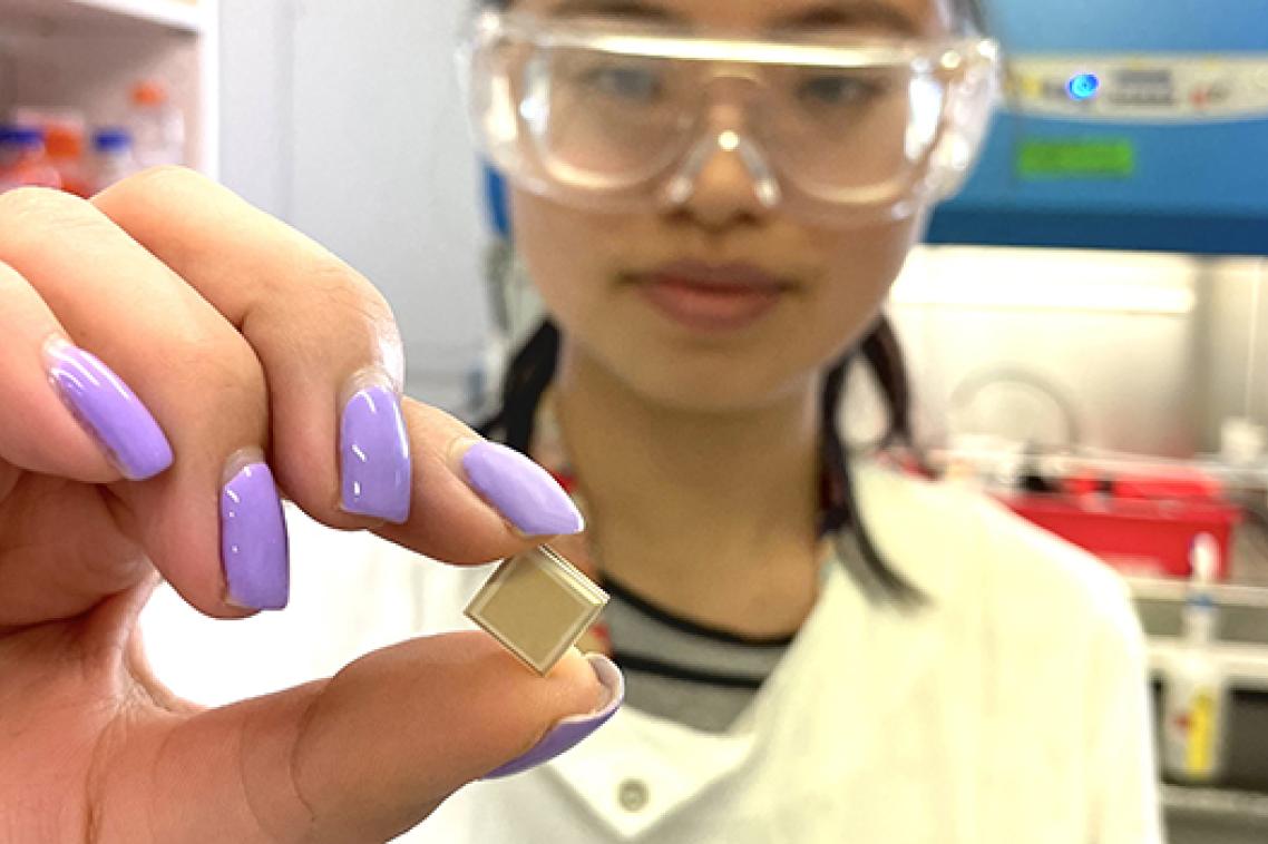 UQ PhD candidate Jovin Choo holding a high-density microarray patch, which could help vaccinate for dengue in a single click.
