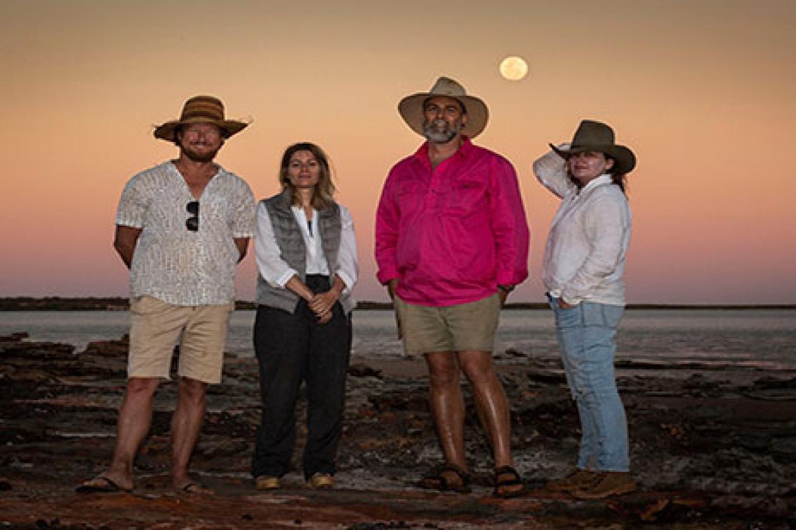 (L-R) Filmmaker Mark Jones, curator Marion Vasseur Raluy, UQ palaeontologist Dr Steve Salisbury and artist Angelika Markul, surrounded by dinosaur tracks on Roebuck Bay. Credit: Damian Kelly.