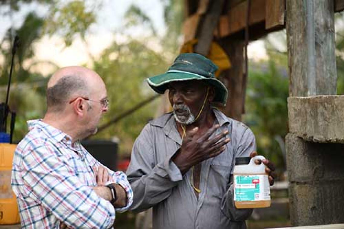 researcher-talking-with-fijian-farmer-about-problems-associated-with-pesticides