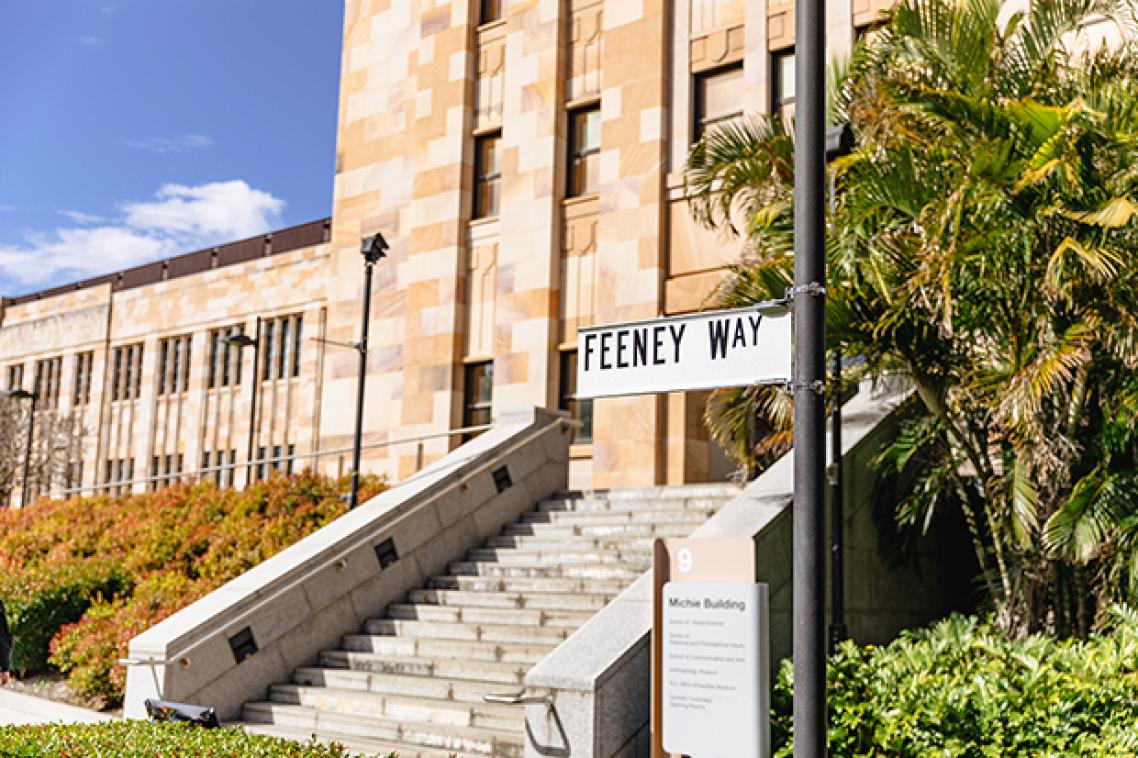 Feeney Way sign in front of building