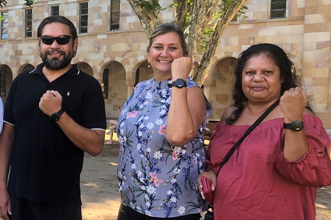 Sleep coaches Jamie Dunne and Karen Chong and Cultural Advisor Roslyn Von Senden hold up monitoring watches