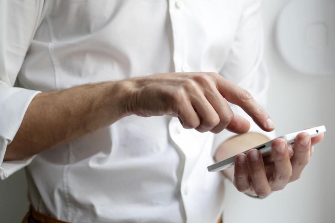 Man's hand on smart phone