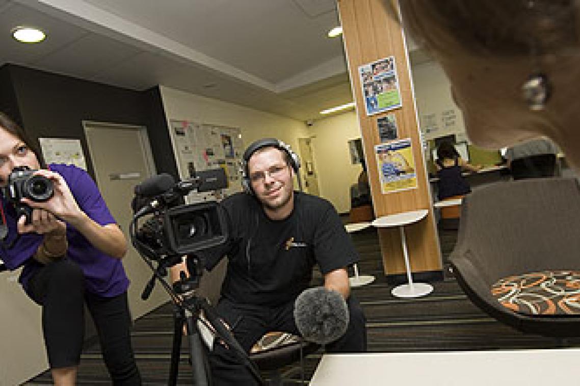 Journalisim students Kim Smith and Adam Evans interview Brenda Nadjiwan at World Press Freedom Day
