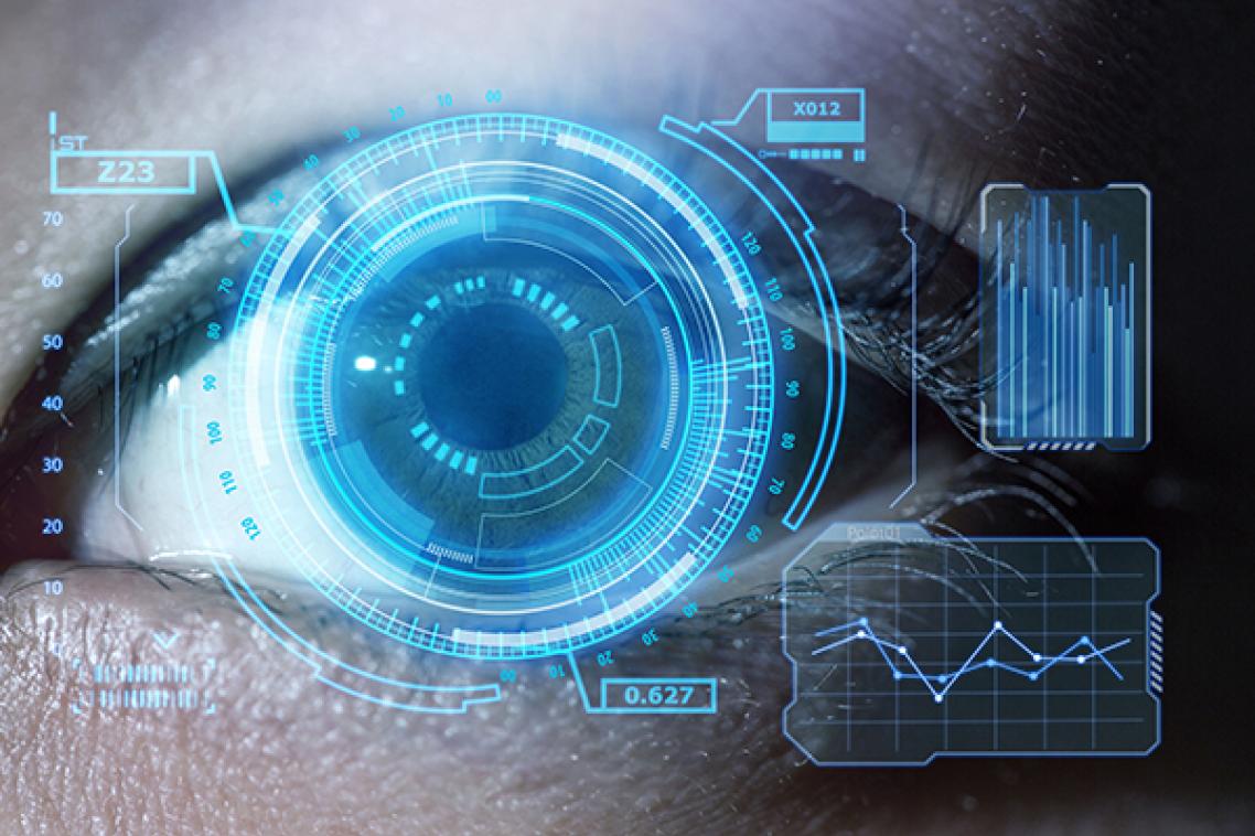 Human eye with computer screening image on top of it