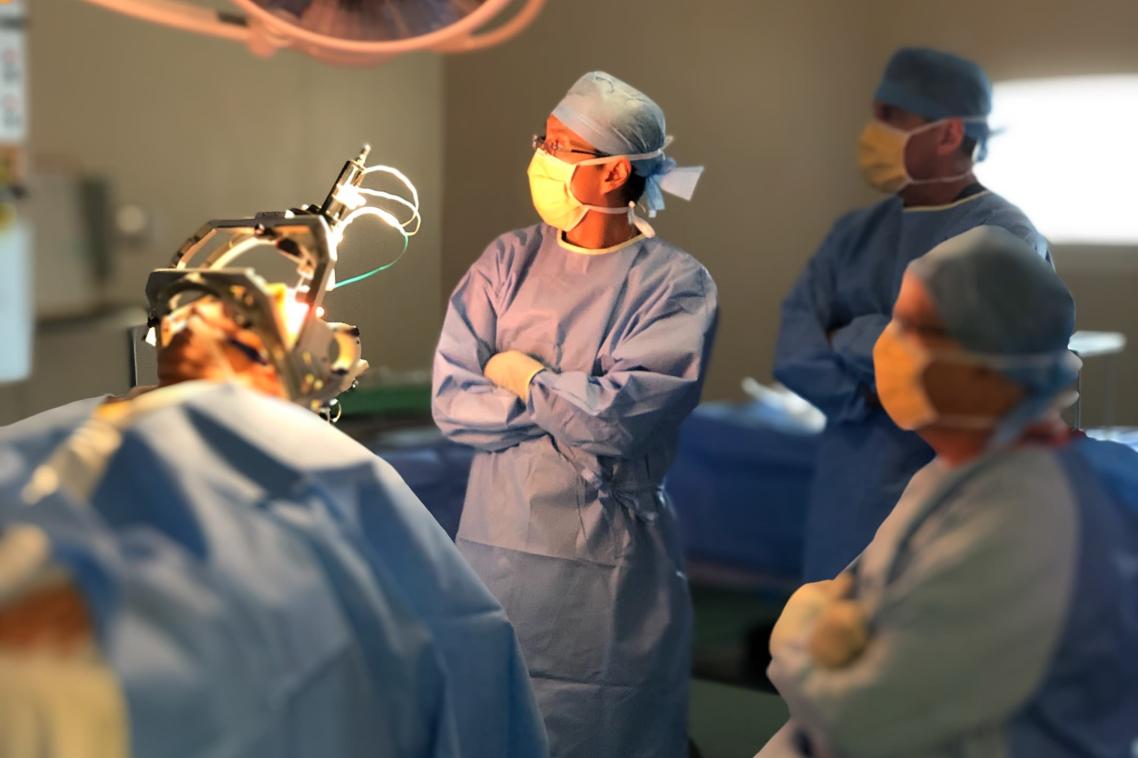 Surgeons in an operating theatre with a patient