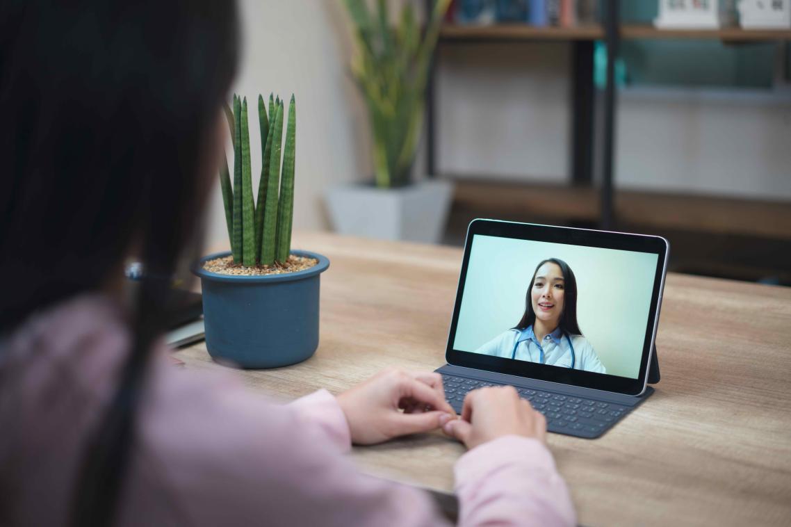 A woman having a telehealth consultation with her GP during the COVID-19 pandemic.