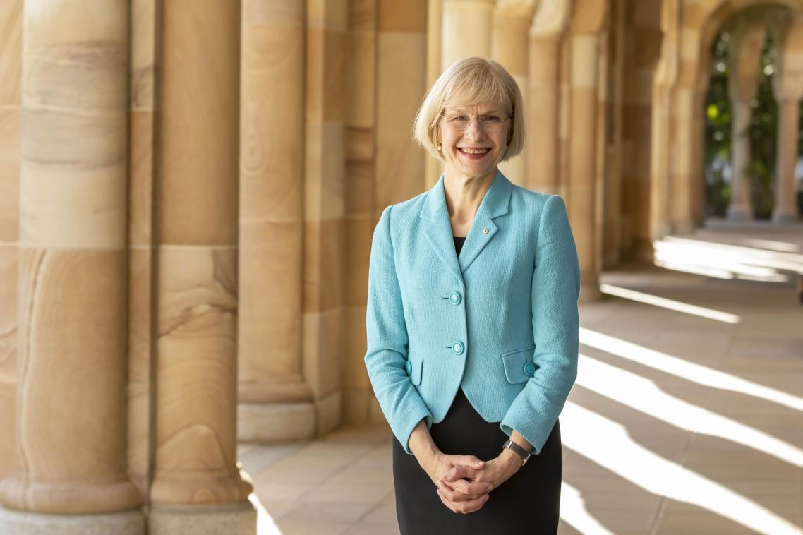 UQ Vice-Chancellor stands in the cloisters of the Great Court at the St Lucia campus.