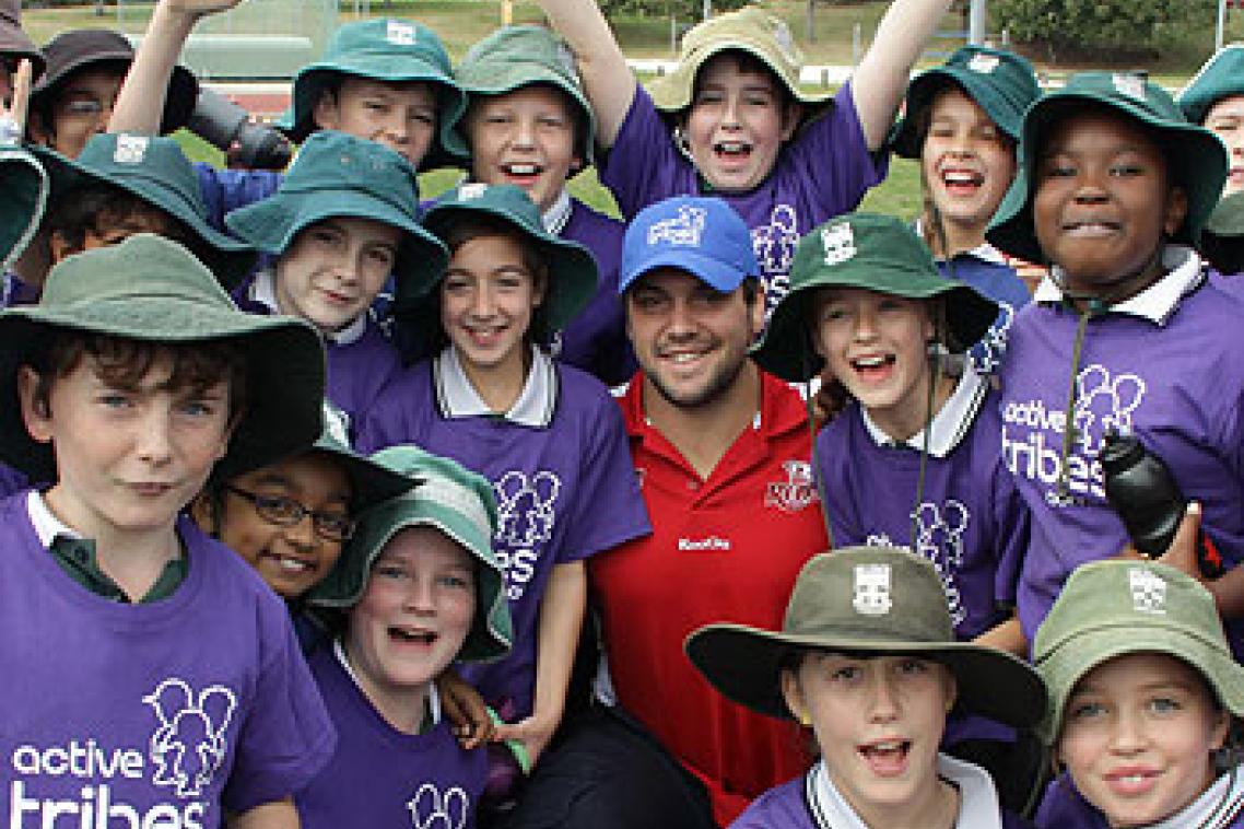 Queensland Reds player and UQ student James Hanson with students from St Ita’s Primary School at the Active Tribes launch