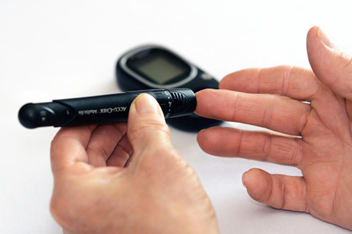A diabetic performs a pin-prick test.