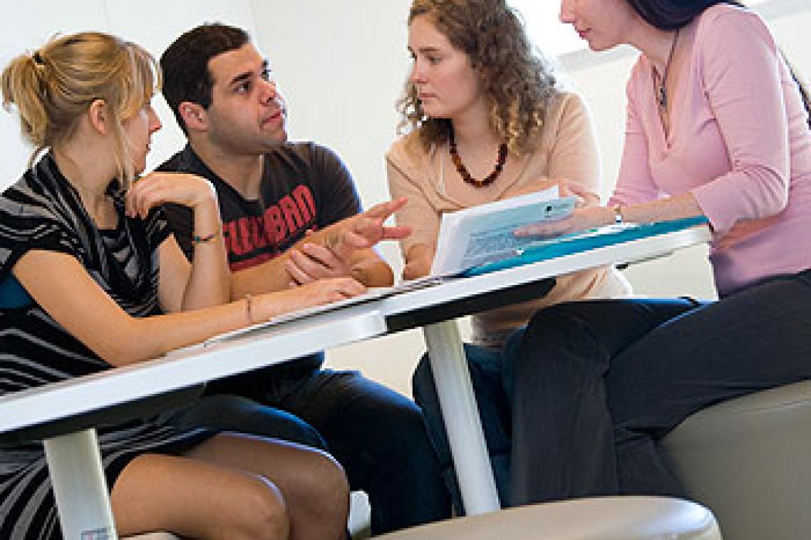 Students Jocelyn Farebrothere, Joel Wright and Tess Millerick participate in group work with lecturer Dr Katelyn Barney