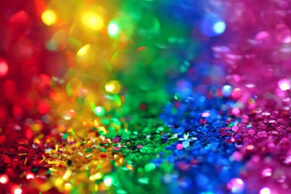 Piles of sequins in the colours of the rainbow flag. Image: Pexels/Sharon McCutcheon