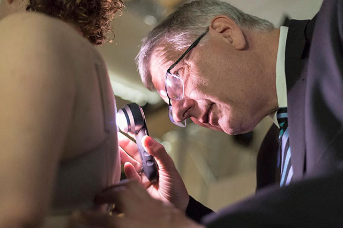 Professor H Peter Soyer examining a patient
