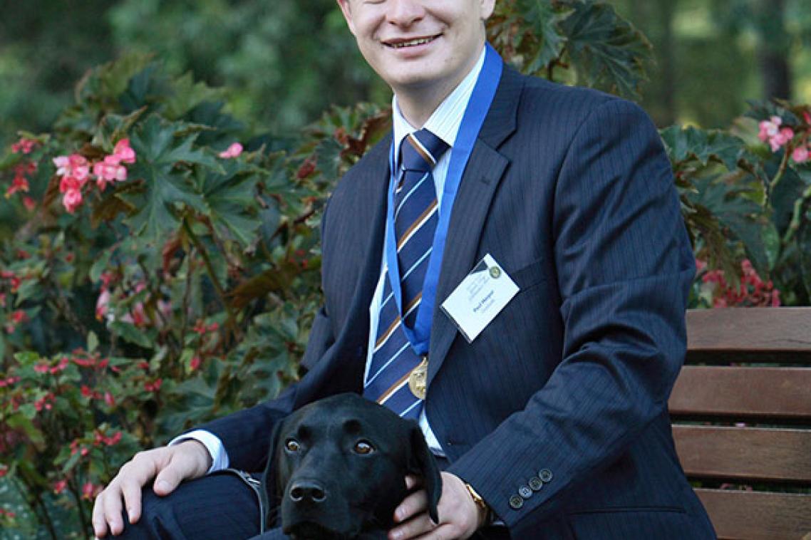 Associate Professor Paul Harpur and his guide dog, Chester