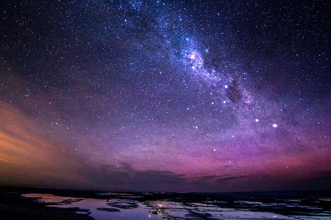 landscape with galaxy in the background