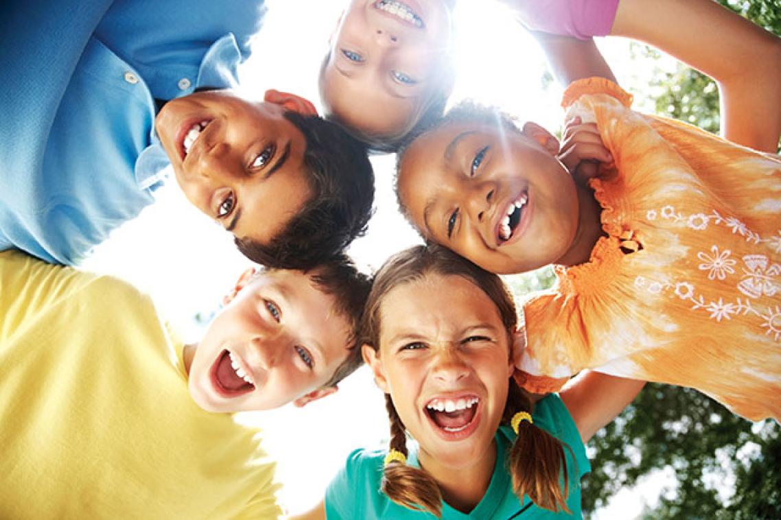 Smiling children in a huddle