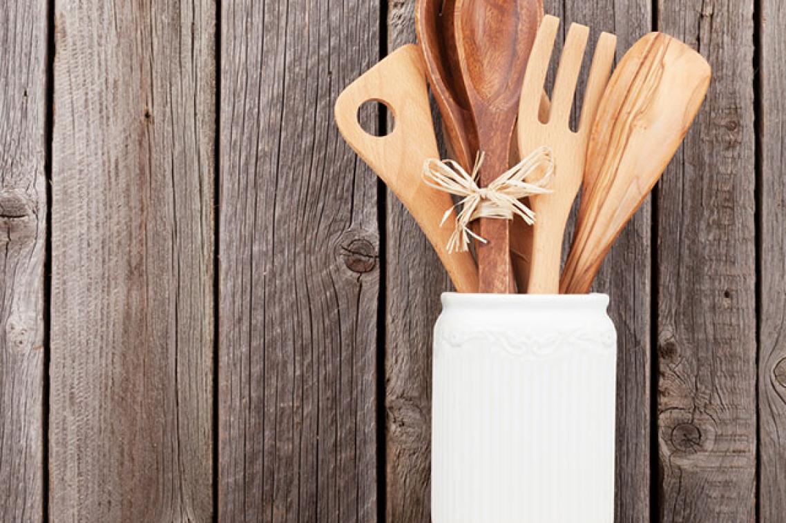 wooden kitchen utensils on a shelf