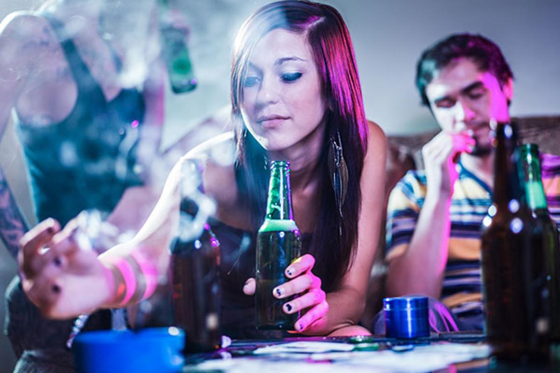 People drinking alcohol and smoking