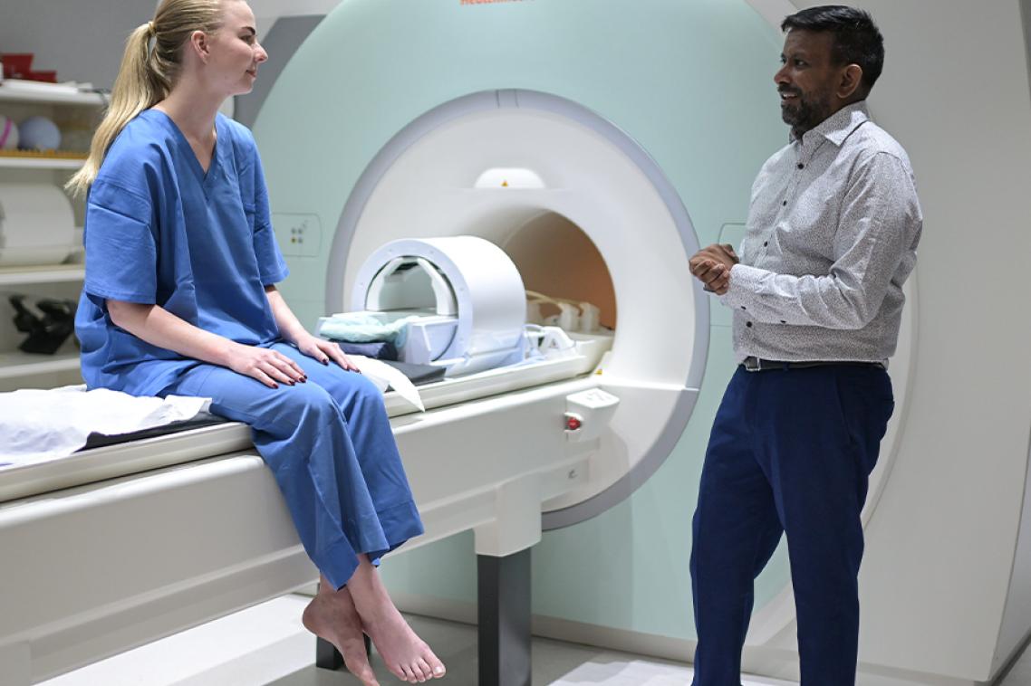 Shekhar Chandra with a patient at the University of Queensland’s Centre for Advanced Imaging