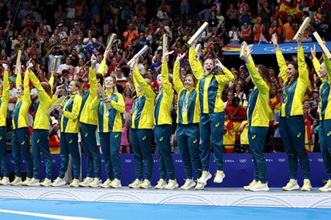 The Australian women's water polo team celebrate after winning a silver medal in Paris