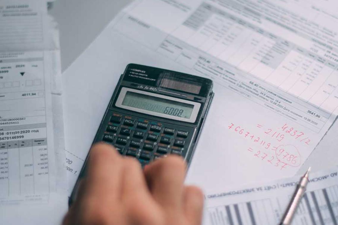 A person calculating finances
